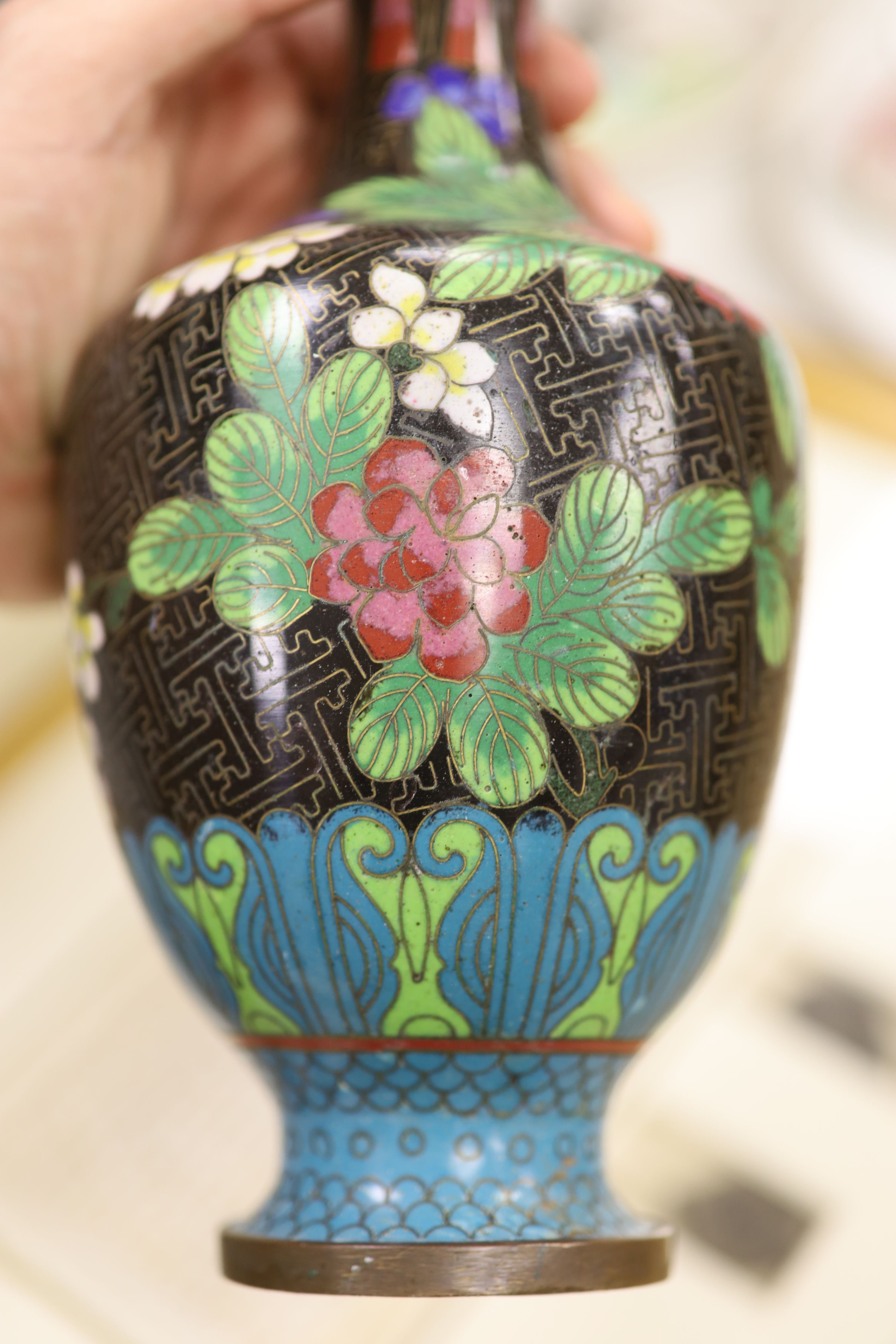 Three Chinese blue and white vases, a cloisonne enamel vase, another vase and a soapstone figure